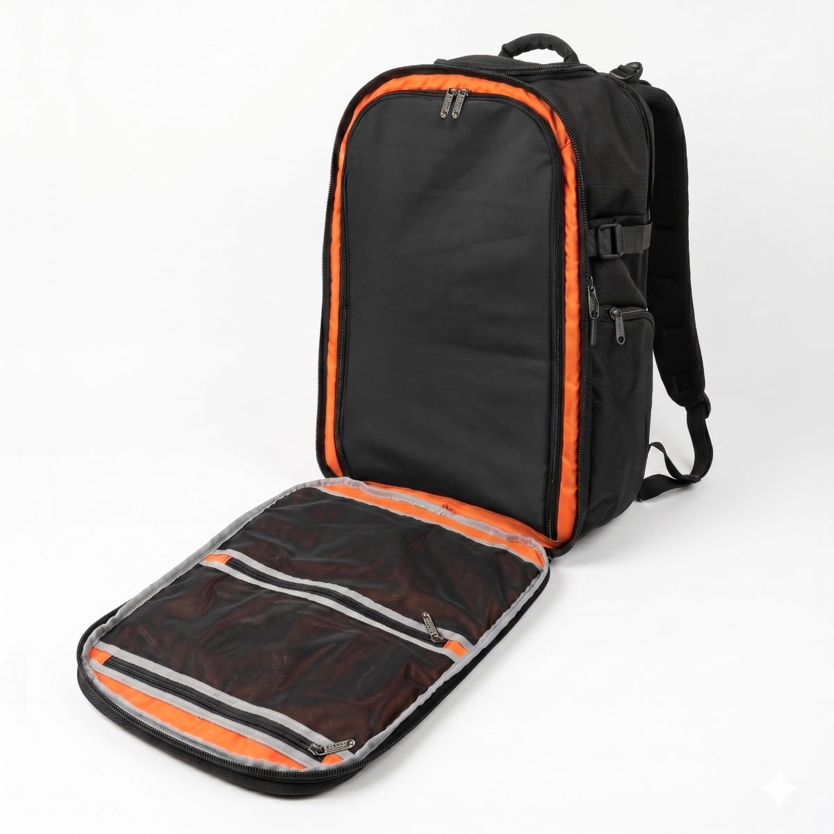 EVERKI ONE with its clamshell main compartment opened flat, showing the orange interior and the zippered mesh pockets inside the front panel.