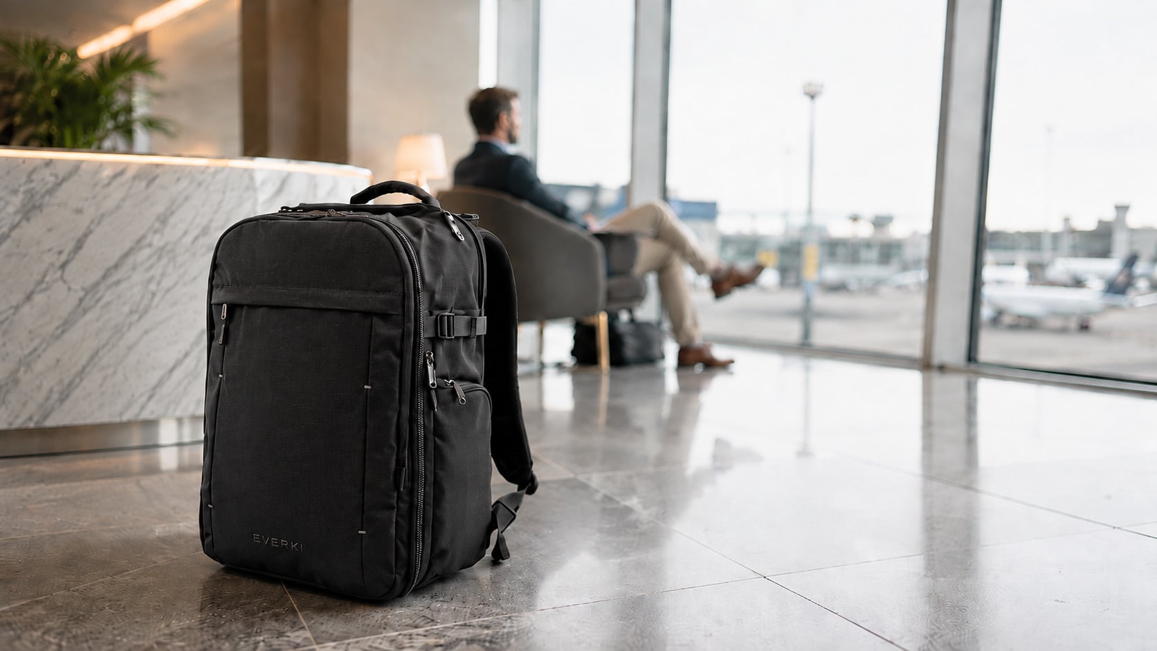 EVERKI ONE travel backpack worn in an airport setting